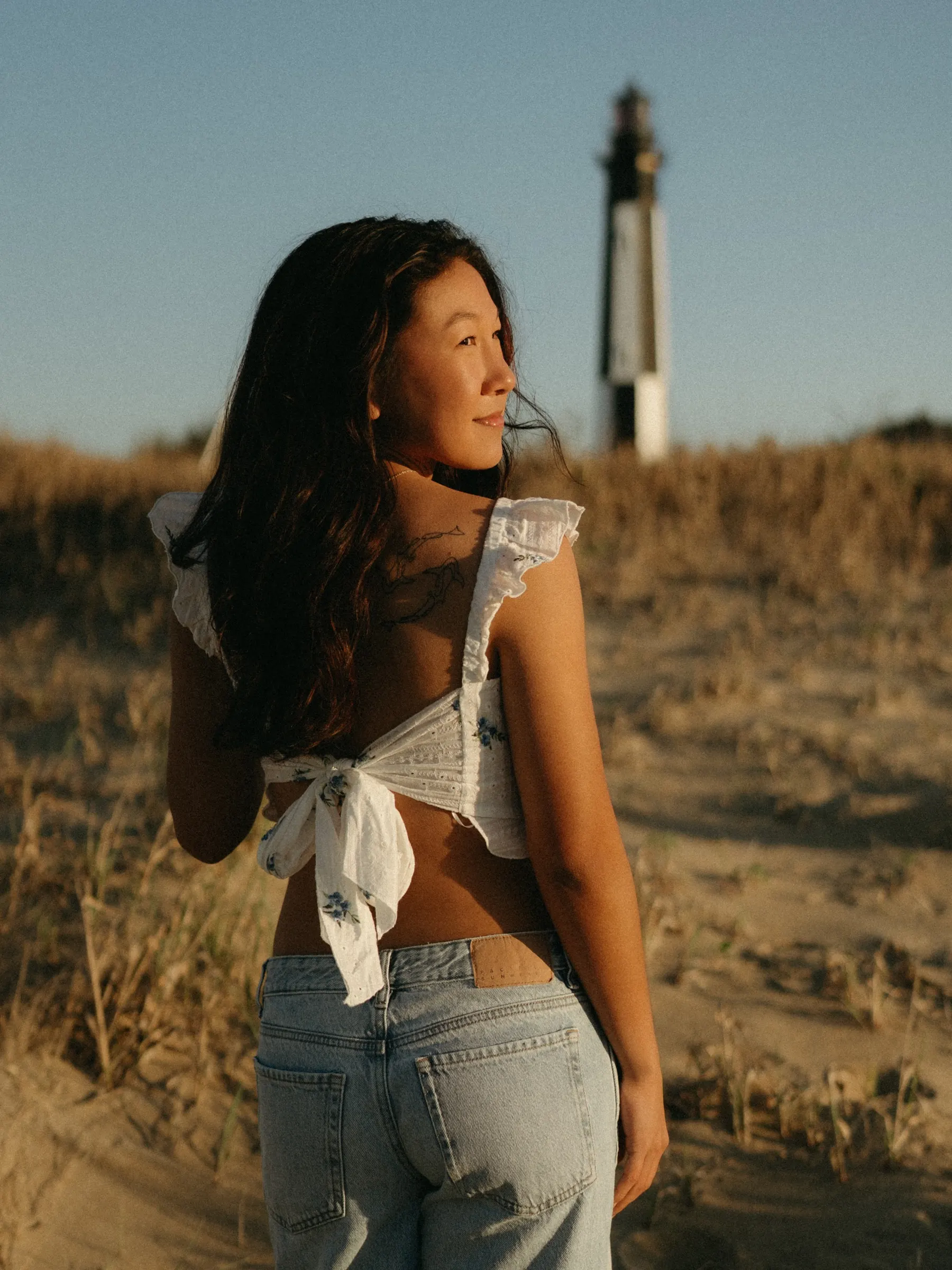 Chalei senior session on fort story beach portrait with lighthouse