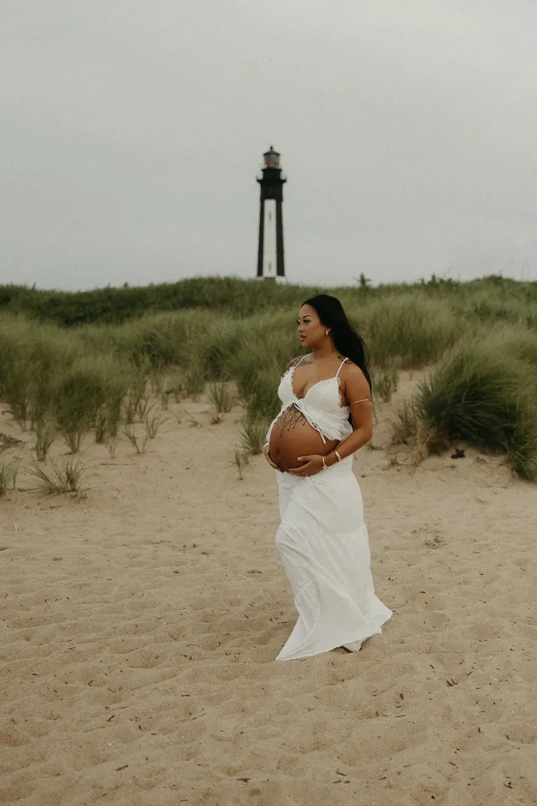 couples maternity photoshoot on fort story beach in Virginia Beach, Virginia