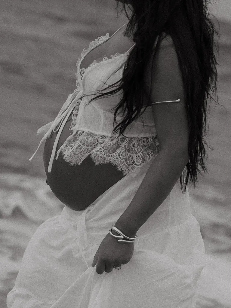couples maternity photoshoot on fort story beach in Virginia Beach, Virginia