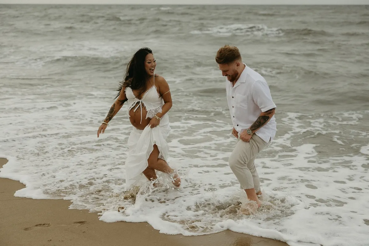 couples maternity photoshoot on fort story beach in Virginia Beach, Virginia