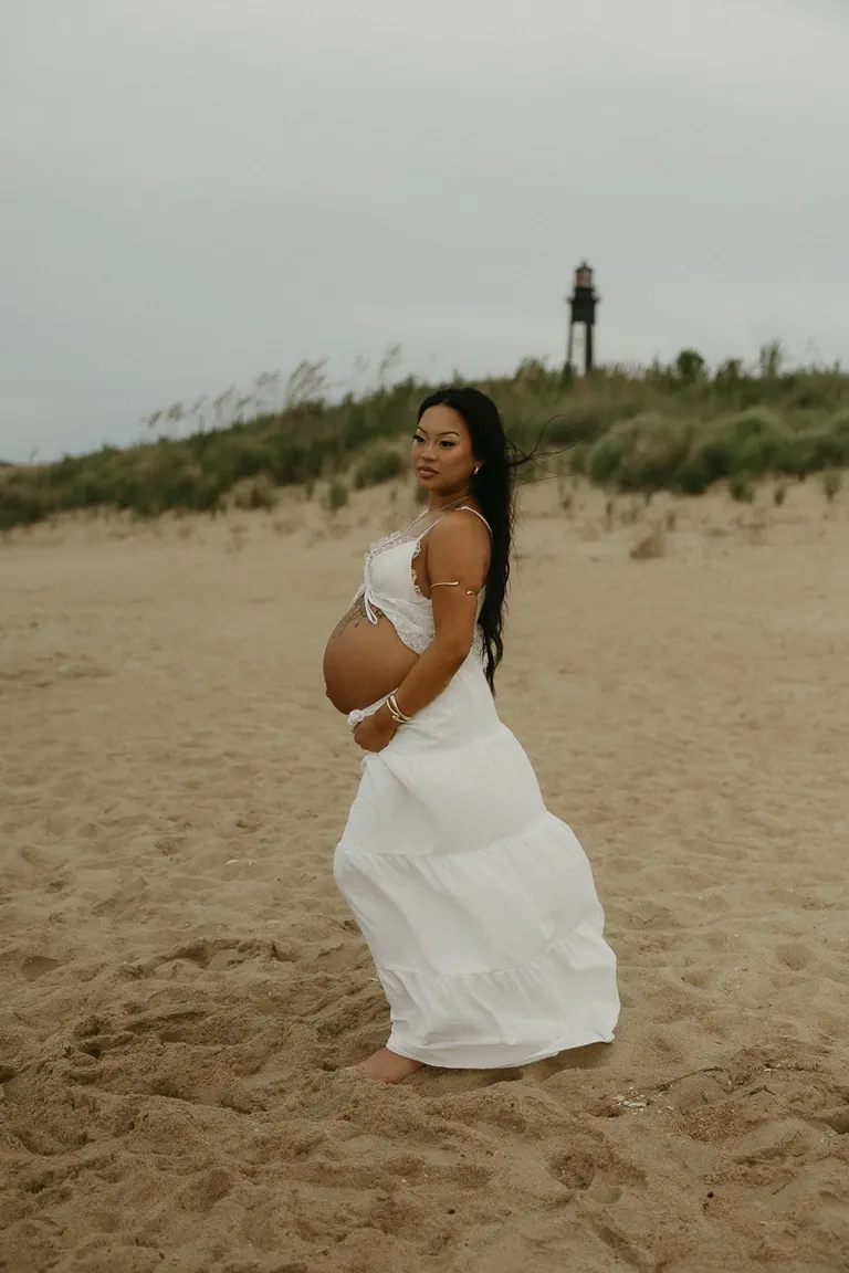 couples maternity photoshoot on fort story beach in Virginia Beach, Virginia