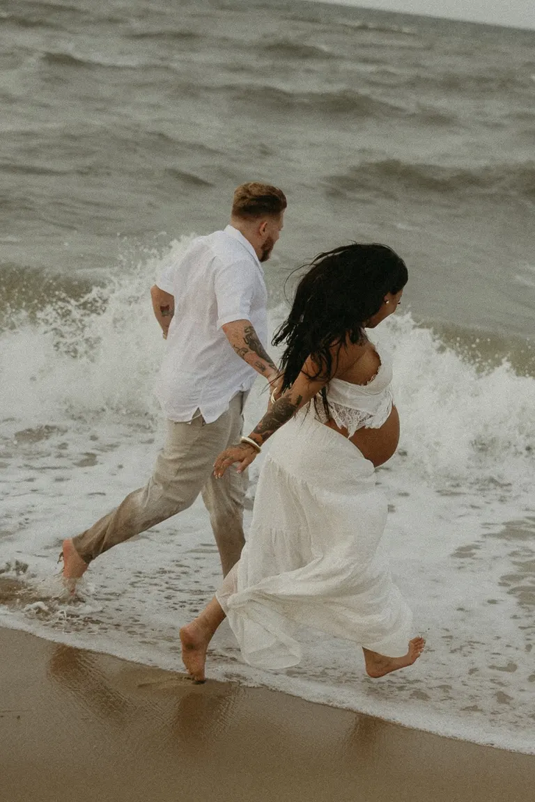 couples maternity photoshoot on fort story beach in Virginia Beach, Virginia